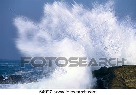 Waves breaking on rocks View Large Photo Image Stock Photo - Waves breaking on rocks . Fotosearch