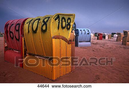 Picture - Wicker beach chairs on beach, Bensersiel, Germany . Fotosearch