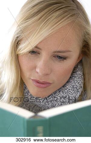 Woman reading a book View Large Photo Image Stock Photograph - Woman reading a book . Fotosearch