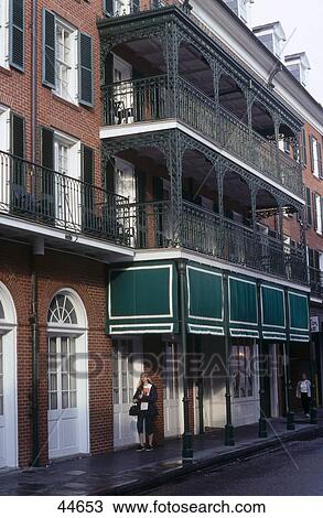 Woman standing in front of house, French Quarter, Bourbon Street, New Orleans, Louisiana, USA View Large Photo Image Stock Image - Woman standing in front of house, French Quarter, Bourbon Street, New Orleans, Louisiana, USA . Fotosearch
