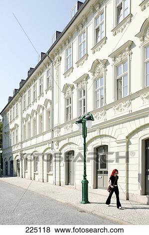 Stock Photo - Woman walking on sidewalk, Weimar, Thuringia, Germany . Fotosearch
