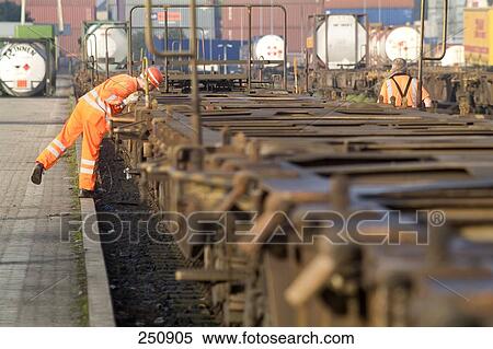 Workers checking empty container wagons, Duisburg, Ruhr Basin, North Rhine-Westphalia, Germany View Large Photo Image Stock Photography - Workers checking empty container wagons, Duisburg, Ruhr Basin, North Rhine-Westphalia, Germany . Fotosearch