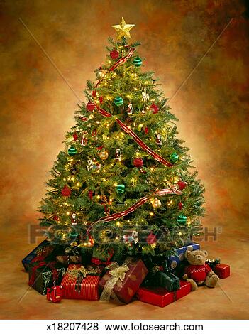 Lighted Christmas Tree With Ornaments And Presents Stock Photo Lighted Christmas Tree With Ornaments