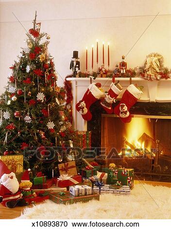 Decorated Christmas Tree And Wrapped Presents Fire In Fireplace