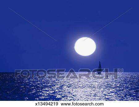 Maldives Islands Full Moon Above Catamaran In Ocean Stock Photo