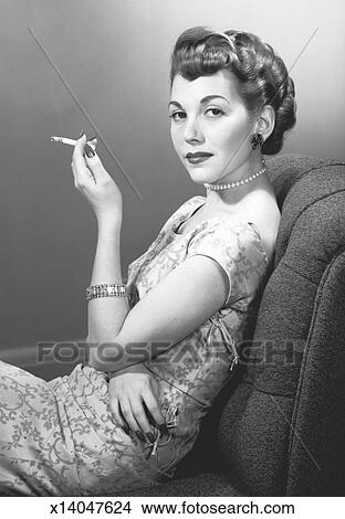 elegant woman smoking cigarette in picture__x14047624