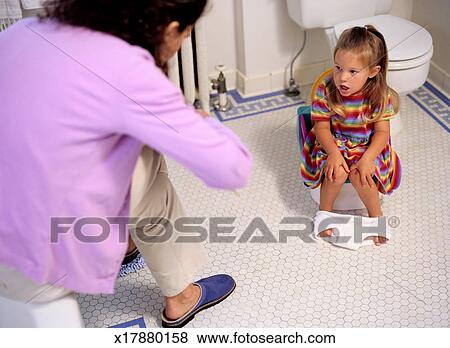 Girl Sitting On A Potty Chair Stock Photo X17880158 Fotosearch