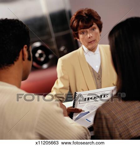 Stock Photo - Bank Loan Officer Explaining Home Loans. Fotosearch - Search Stock Images, Poster Photographs, Pictures, and Clip Art Photos