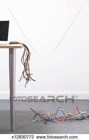 Cables Connected To Laptop On Desk Cut In Half Stock Image