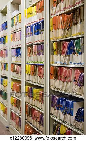 Stacks Of Medical Files In Filing Cabinet Stock Photograph