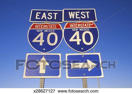 USA, New Mexico, road sign for interstate 40 east and west, low angle ...