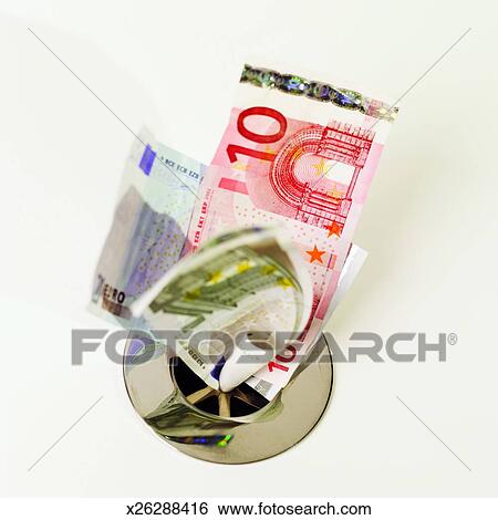 Close Up Of Euro Bank Notes Going Down The Drain Stock Photograph Close Up Of Euro Bank Notes Going Down The Drain Stock Photograph