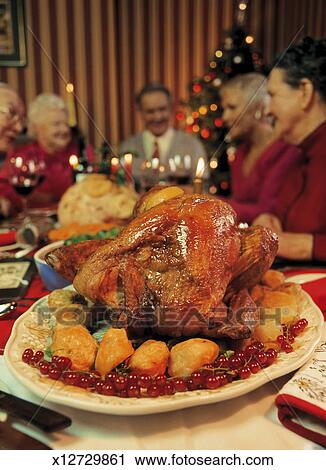 Group of people at thanksgiving dinner table Stock Image | x12729861