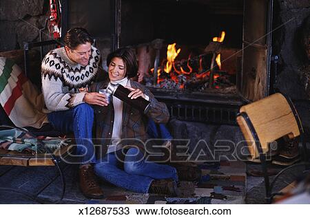 Couple By Ski Lodge Fireplace Stock Image X12687533 Fotosearch