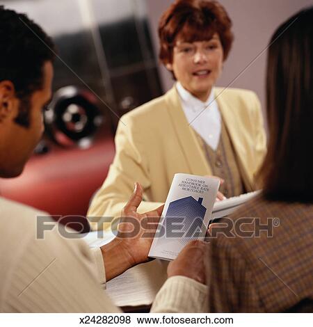 Picture - Bank Loan Officer Explaining Home Loans. Fotosearch - Search Stock Photos, Images, Print Photographs, and Photo Clip Art