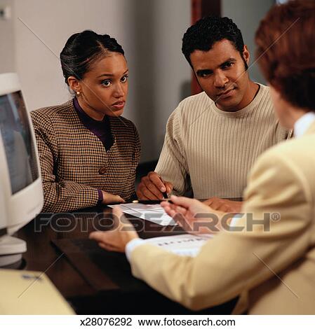 Stock Photo - Couple Filling Out an Application for a Home Loan. Fotosearch - Search Stock Photography, Print Pictures, Images, and Photo Clip Art