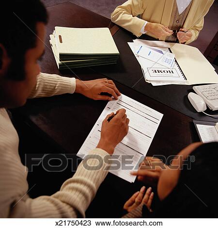 Stock Photo - Filling out a Home Loan Application. Fotosearch - Search Stock Images, Poster Photographs, Pictures, and Clip Art Photos