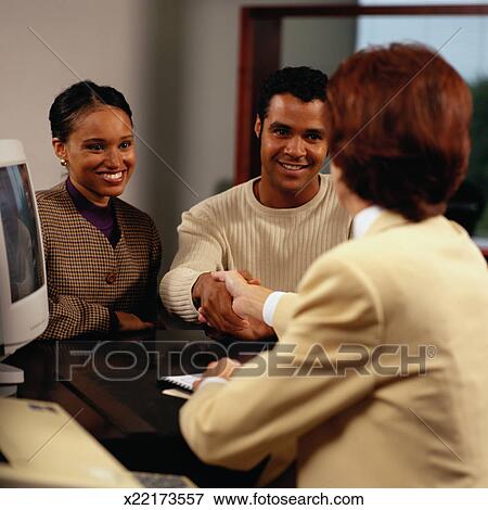 Loan Officer Shaking Hands with a Man View Large Photo Image Picture - Loan Officer Shaking Hands with a Man. Fotosearch - Search Stock Photography, Photos, Prints, Images, and Photo Clipart