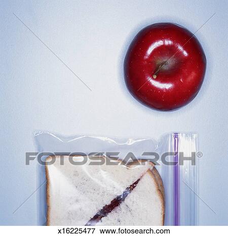 Download Red apple beside peanut butter and jelly sandwich in ... Yellowimages Mockups