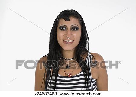 Smiling Young Woman With Face Piercings And Long Hair And Wearing