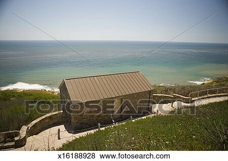 High Angle View Of A Stone Cottage On A Waterfront Pacific Ocean