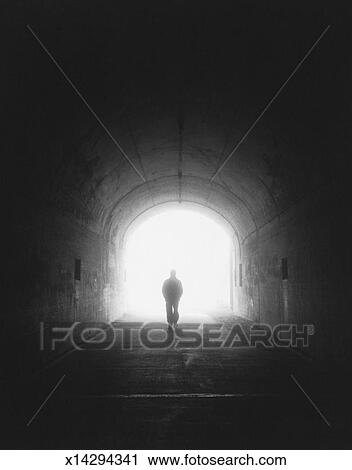 Stock Photography of Man walking through tunnel, silhouette (B&W ... Silhouette Man Walking Tunnel