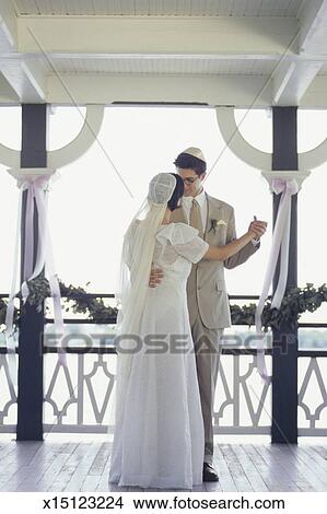 Bride And Groom Dancing On Balcony At Wedding Reception Picture