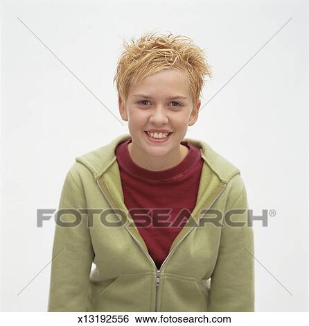 Young Girl With Short Blonde Spiky Hair Posing In Studio Portrait