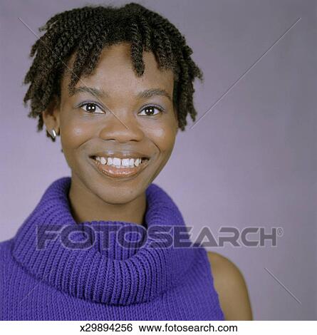 Woman With Short Dreadlocks Posing In Studio Portrait Stock Photograph