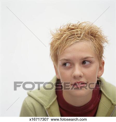 Young Girl With Short Blonde Spiky Hair Posing In Studio Looking