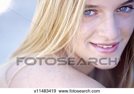 Young Woman With Blonde Hair And Blue Eyes Portrait Stock Photo