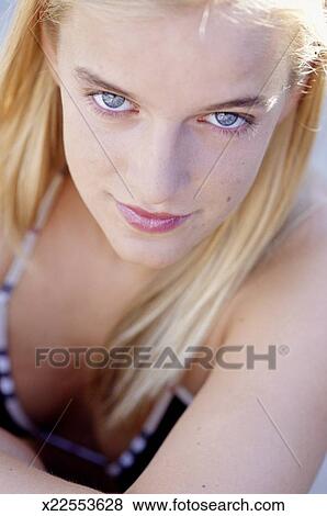 Young Woman With Blonde Hair And Blue Eyes Portrait Stock Photo