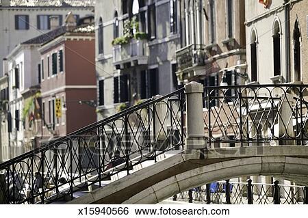 Empty Bridge With Wrought Iron Hand Railing Over River In Old City Stock Photograph Empty Bridge With Wrought Iron Hand Railing Over River In Old City Area
