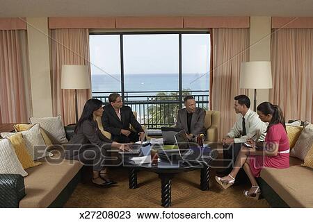 Group Of People Sitting On Couches Stock Image X27208023
