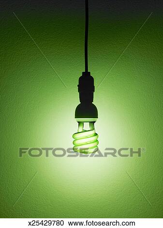Stock Photography Of Eco Friendly Fluorescent Light Bulb Hanging Eco Friendly Fluorescent Light Bulb Hanging Against Green Background