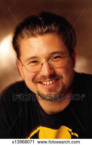 Male Man With Dark Blonde Hair Mustache And Beard Wearing A Black