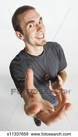 A Caucasian Teenage Boy With Short Hair And A Goatee Is Wearing A