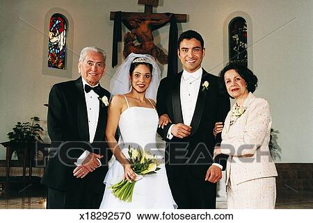 Bride And Groom Family Portrait At A Church Altar Stock Image