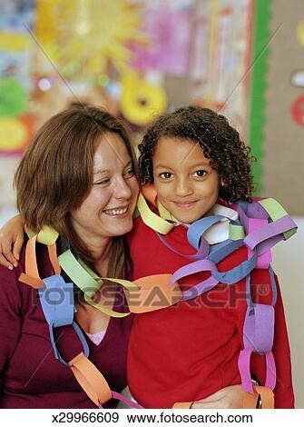 Schoolgirl 5 7 With Teacher Wearing Paper Chains Portrait Schoolgirl 5 7 With Teacher Wearing Paper Chains Portrait