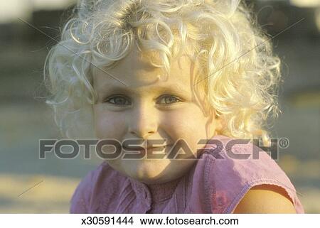 A Smiling Little Girl With Curly Blond Hair Garden Grove Ca
