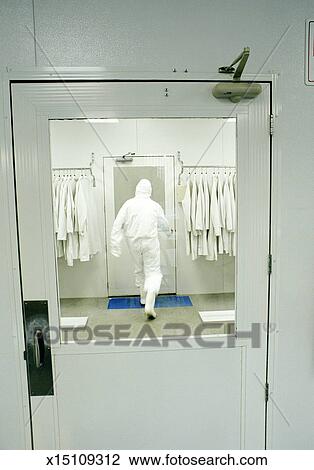 Man Wearing Clean Suit In Computer Chip Manufacturing Plant