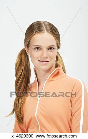 Teenage Girl 13 15 With Hair In Bunches Braces On Teeth