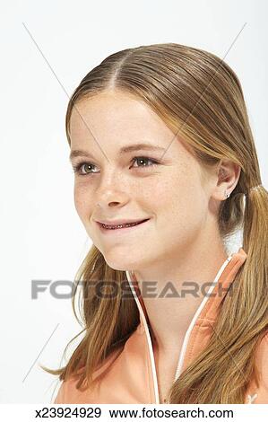 Teenage Girl 13 15 With Hair In Bunches Braces On Teeth Close