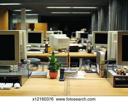 Rows Of Desks With Computers In Empty Office Stock Photograph