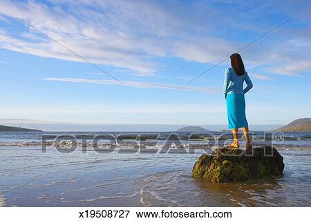 picture of ireland ulster county donegal woman standing on rock