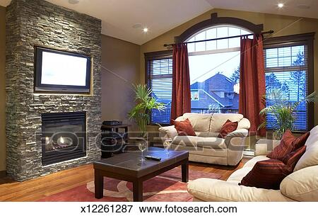 Modern Living Room With Fireplace And Flat Screen Television Stock