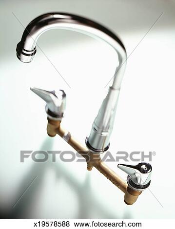 A Chrome Kitchen Faucet Showing Connections Stock Photo
