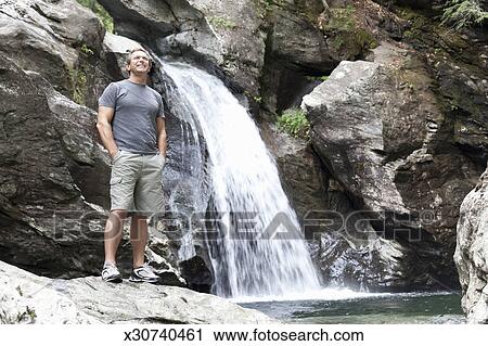 Man Standing A Edge Of Waterfall Stock Image X30740461 Man Standing A Edge Of Waterfall