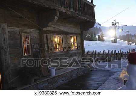 Log Cabin At Ski Resort Sunset Stock Photograph X19330826