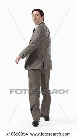 Business Man Walking Away From Camera Looking Back Picture
